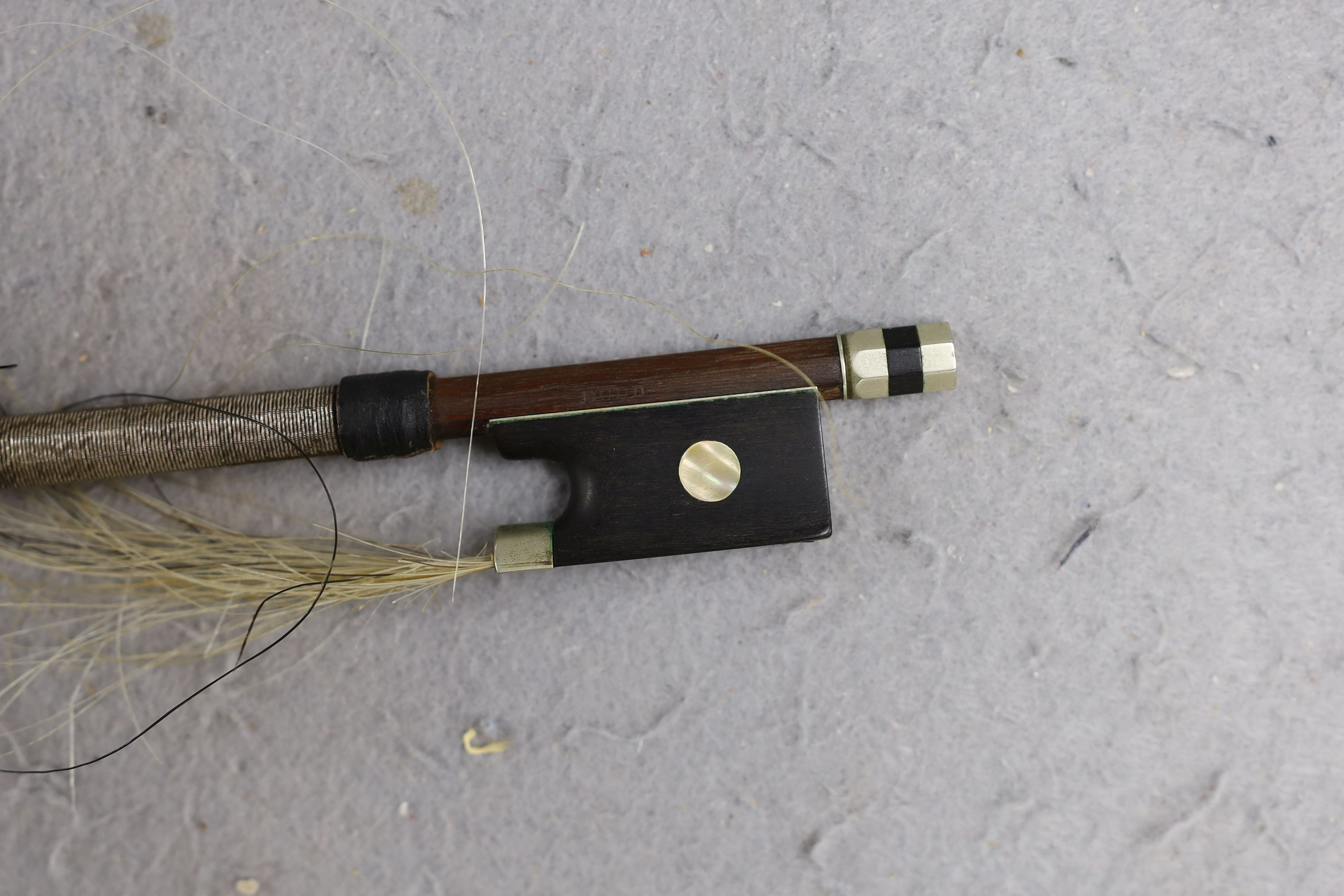 A cased 19th century violin, labelled Stradivarius 1690, with a Dodd bow